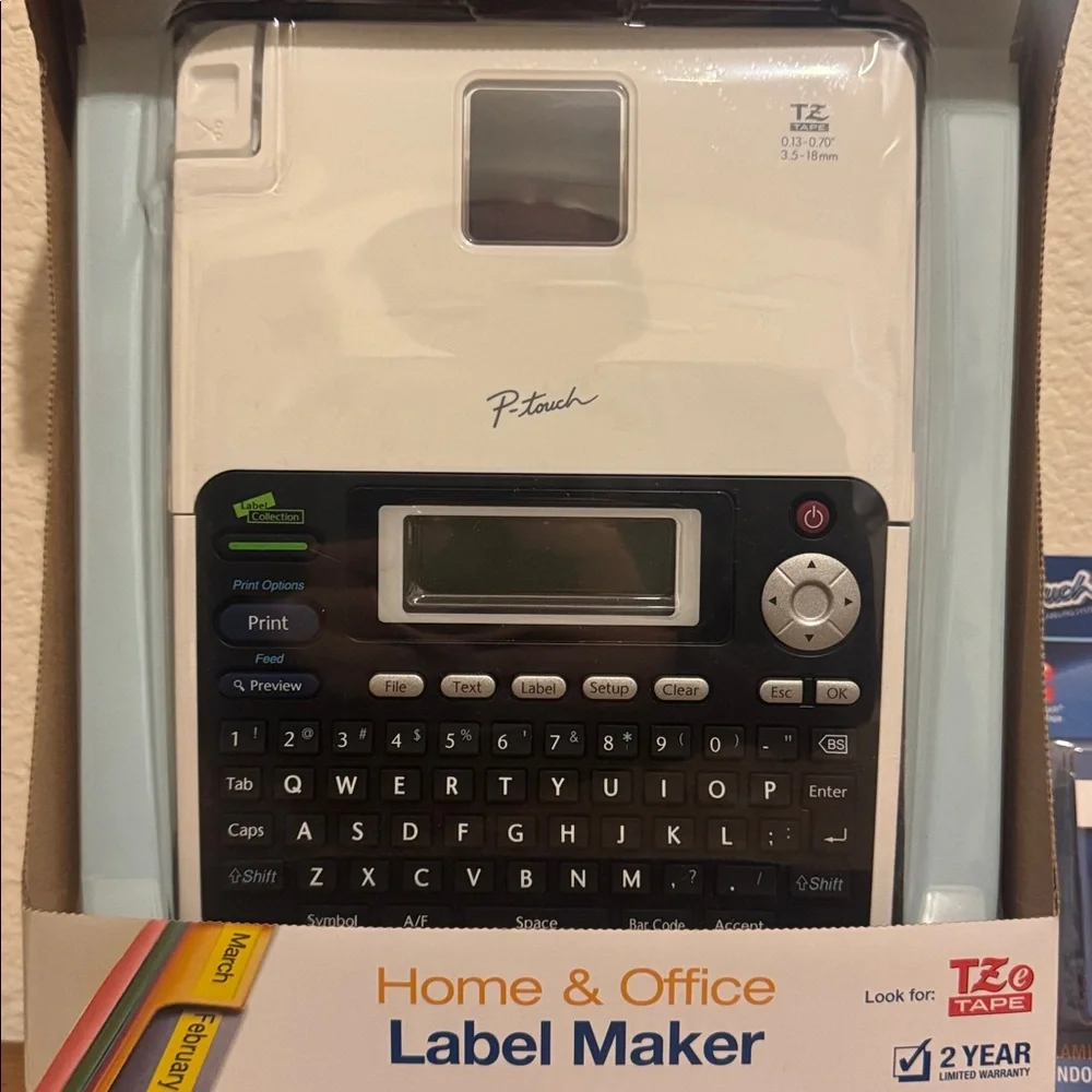 New Brother PT-2030 Label Maker with Black Print on White Tape